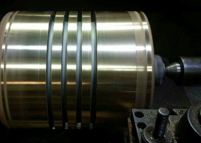 PISTON WITH BRASS RIDER BANDS by Reliable Machine Services
